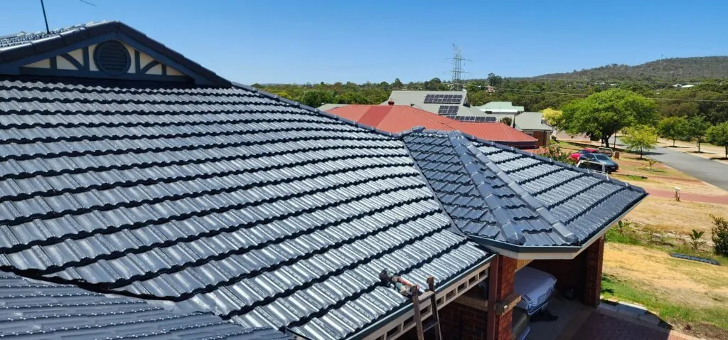 Charcoal tile roof restored by Kili & Cousins on a Perth home with the hills in the background