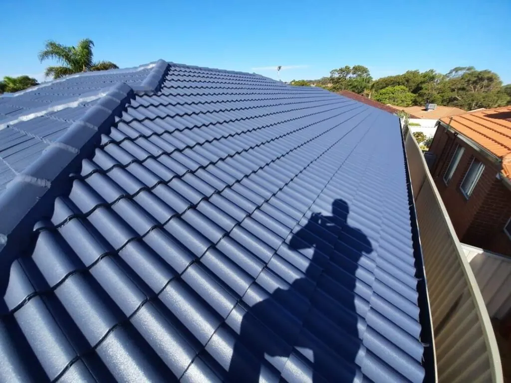 Finished dark coated tile roof on a Perth home after painting