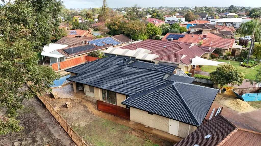 Drone view of a completed tile roof restoration by Kili & Cousins